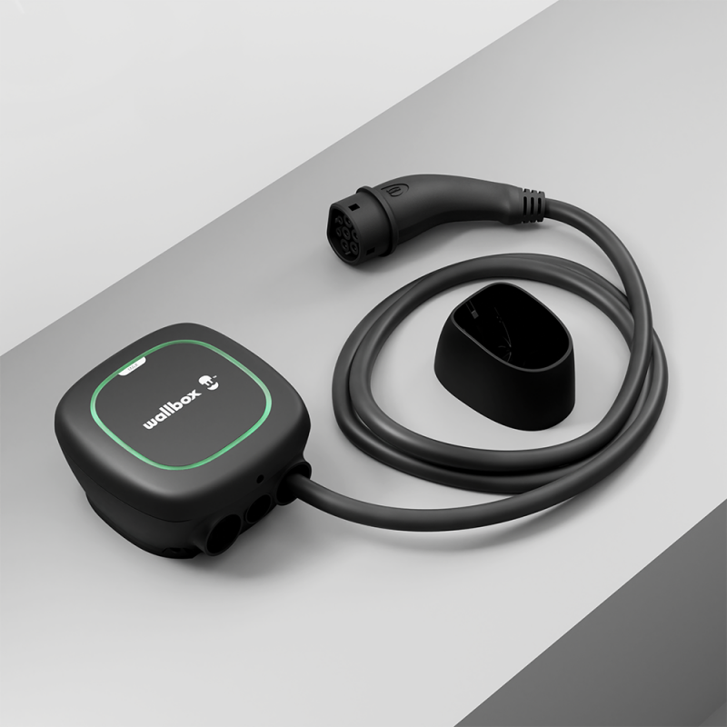 Black Wallbox Pulsar Max electric car charger with cable and Type 2 connector, angled catalogue view. Illustrative accessories not included.